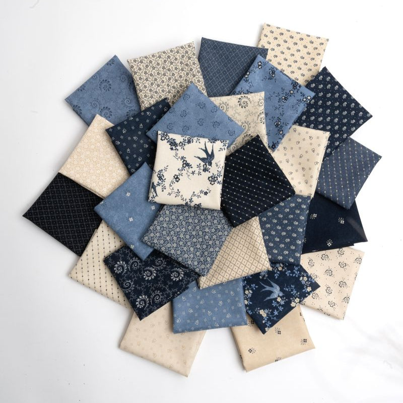 Collection of fabric squares in blue, beige, and black patterns on a white background