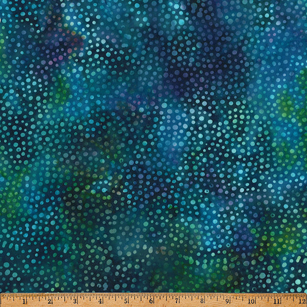 Blue and green polka dot fabric with a ruler at the bottom for scale.