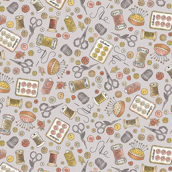 Fabric with sewing notions on gray background