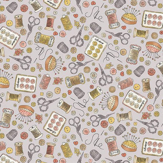 Fabric with sewing notions on gray background