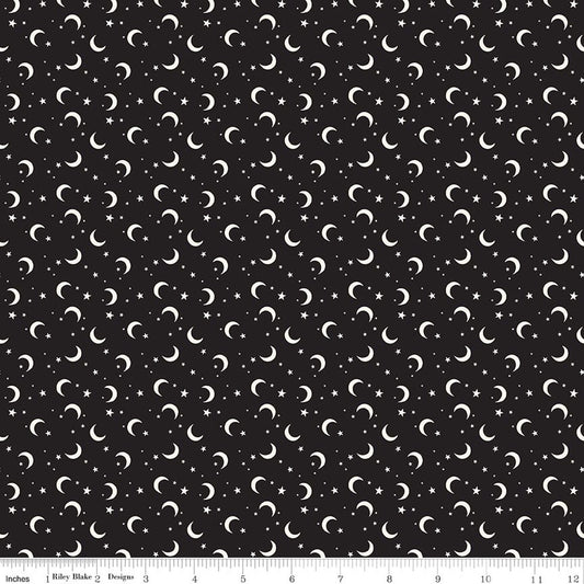 Fabric of white crescent moons and stars on a black background 