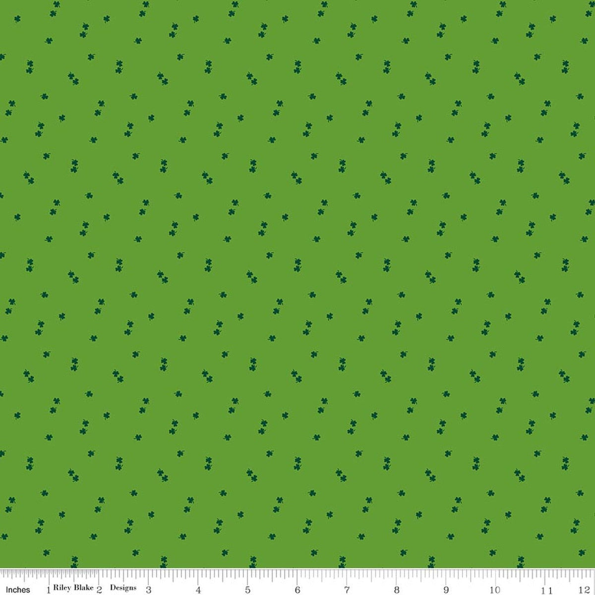 Green fabric with small black dots pattern