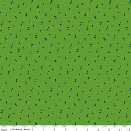 Green fabric with small black dots pattern