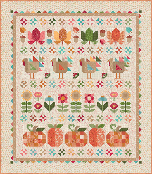 Colorful quilt with geometric patterns of flowers, pumpkins, and turkeys on a beige background.