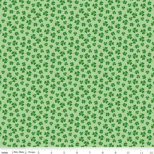 Pattern of green shamrocks on a light green background
